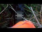 hi vis orange boilersuit in mud